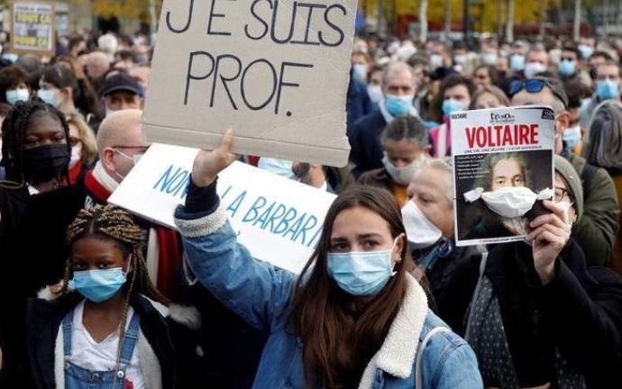 'Teaching yes, bleeding no': France pays tribute to beheaded teacher