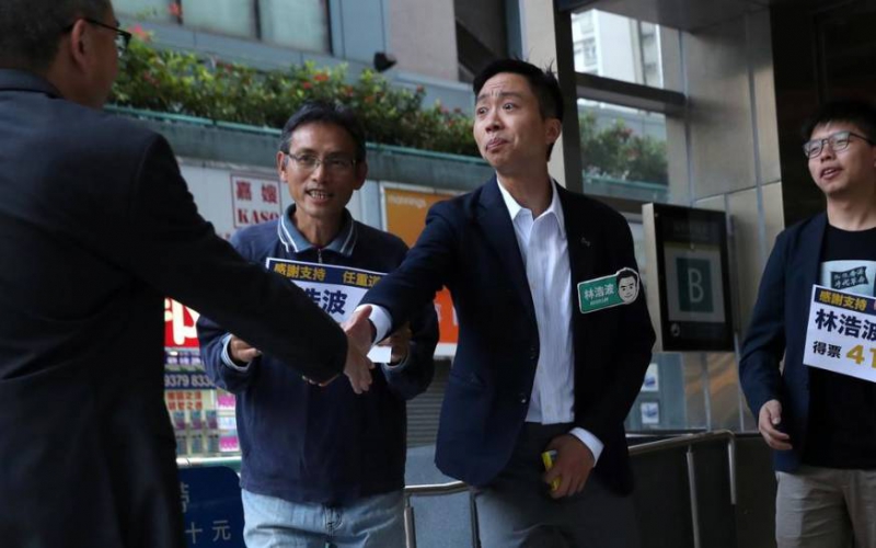 Landslide democratic win in HK election raises pressure on city's leader