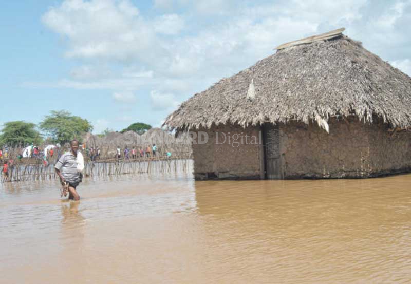 Thousands seek help as floods cut off village