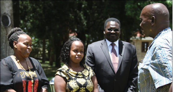  Moi shares a word with Nzisa (second left) as her mother Rose Wambua and the Chief Principal Henry Kiplagat of Kabarak High look on. [PHOTO: BONIFACE THUKU/STANDARD]