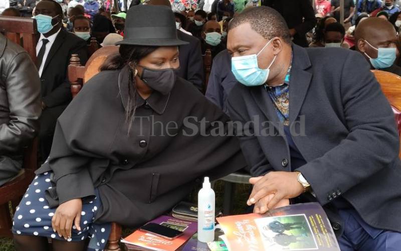 Mbarire (left) & Justin Muturi during the burial 