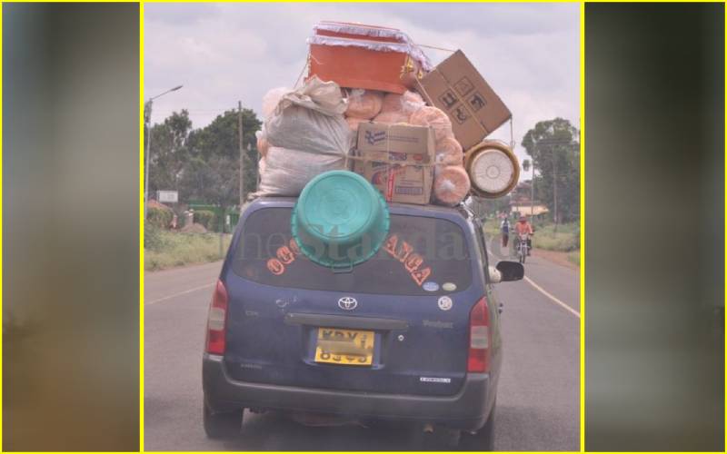 Probox ferrying a coffin in Usenge, Bondo.