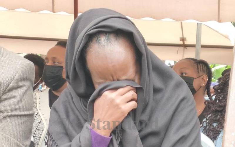 The brothers' mother in tears during the burial