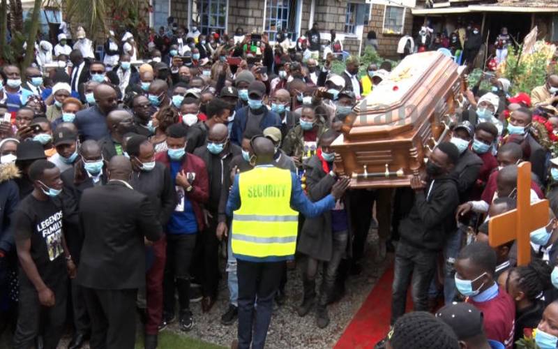 Pallbearers ferrying body of one of the brothers 