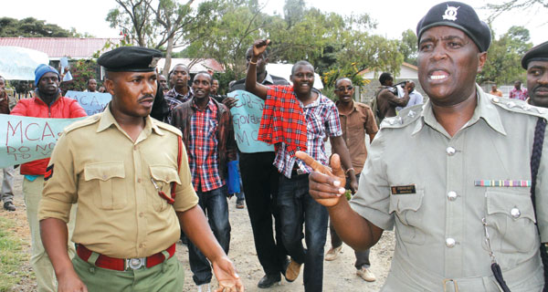 University students protest outside the Kajiado County offices. 