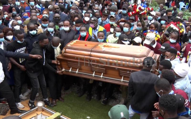 Caskets bearing the brothers' remains at grave 