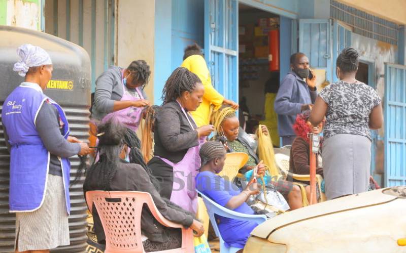 Salonists plaiting 'Newy Year hair' in Kisii.