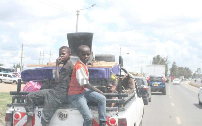 Two boys on a pickup along Kangundo Road