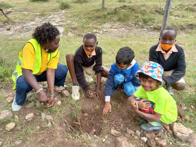Tecla Lorupe leads tree planting exercise in Masailand