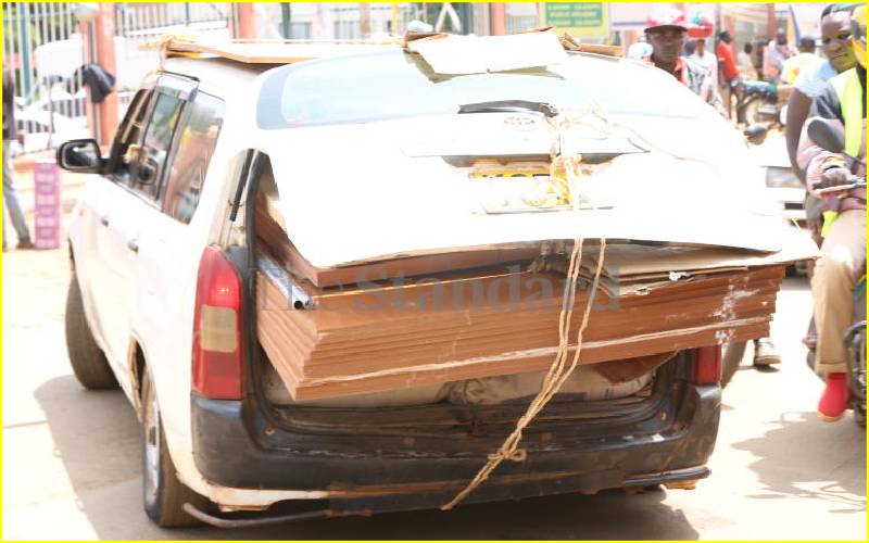 Probox transporting construction materials, Kisii