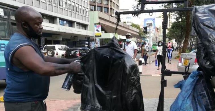 Disabled man cleans boda boda riders' jackets - The Standard