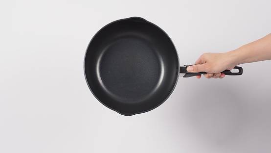 Woman hammers neighbour over frying pan