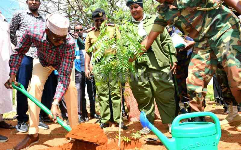 Wajir Governor planting a tree at Wajir Airbase