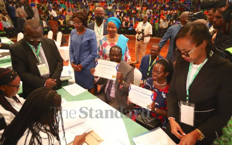 Raila & Karua displaying their nomination papers.