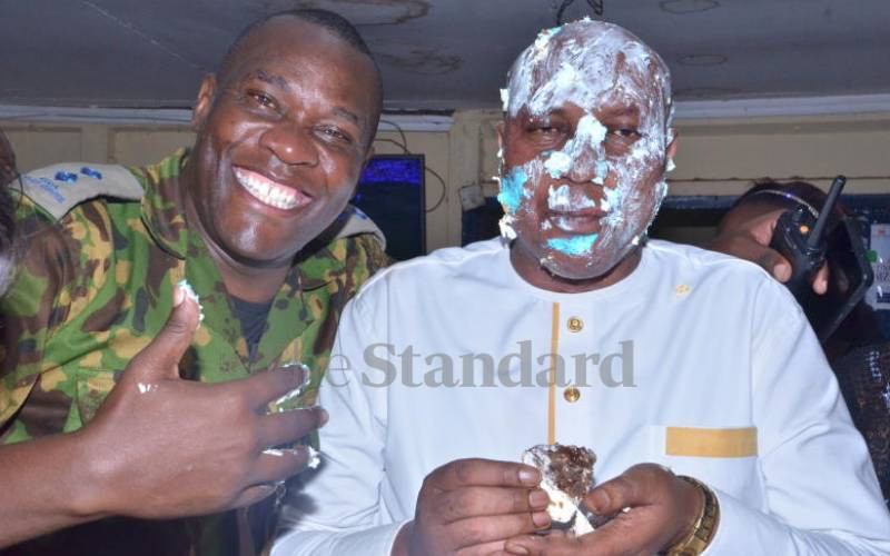 Farewell: Outgoing Kabete Chief Inspector Benson Mwai smeared in cake
