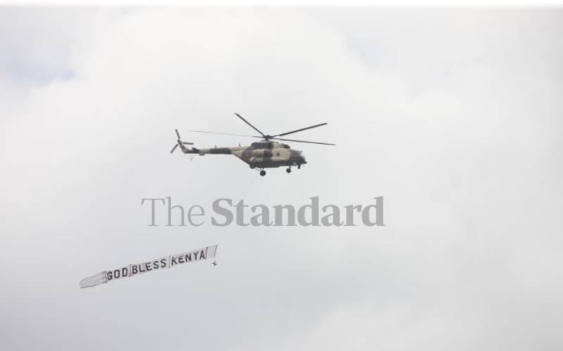 Helicopter flying past the dais.