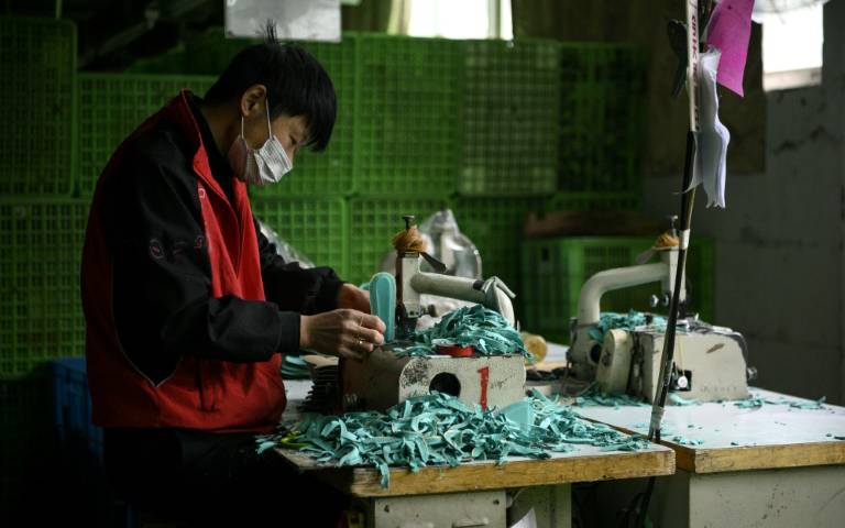 One worker at a time, virus-hit China's factories sputter back online