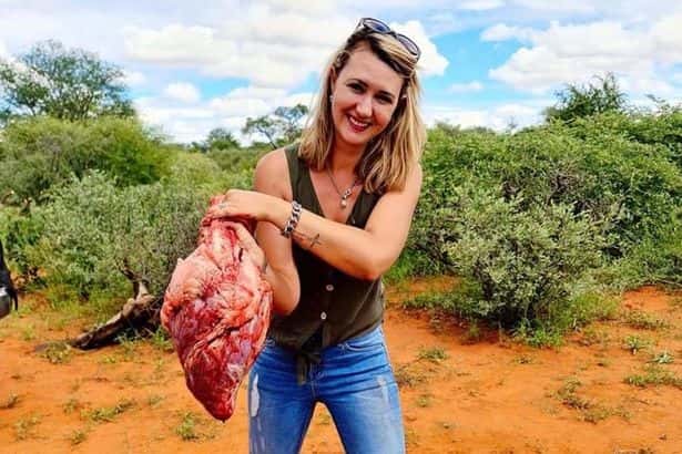 Trophy hunter poses with 'Valentine's gift' - the heart of giraffe she just shot