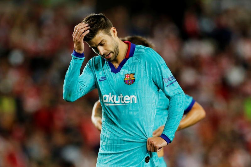 Barcelona's Pique cycled to derby match with Espanyol