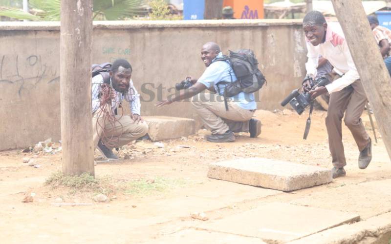 Journalists take cover during Kisumu riots