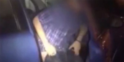 Embarrassed couple caught making love on the back seat at city parking bay