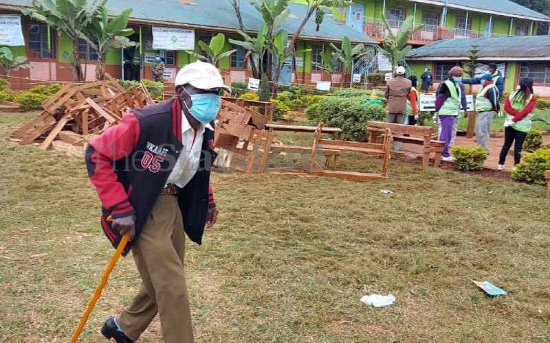 Man walks off after casting his vote in Muguga