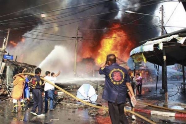 One dead, dozens wounded in wave of bombs in south Thailand