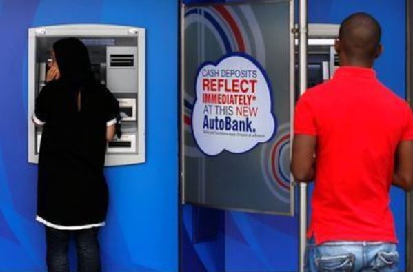 Standard Bank leaves door open to dividend despite profit plunge