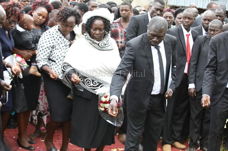 Politics play out at athlete Bett's burial
