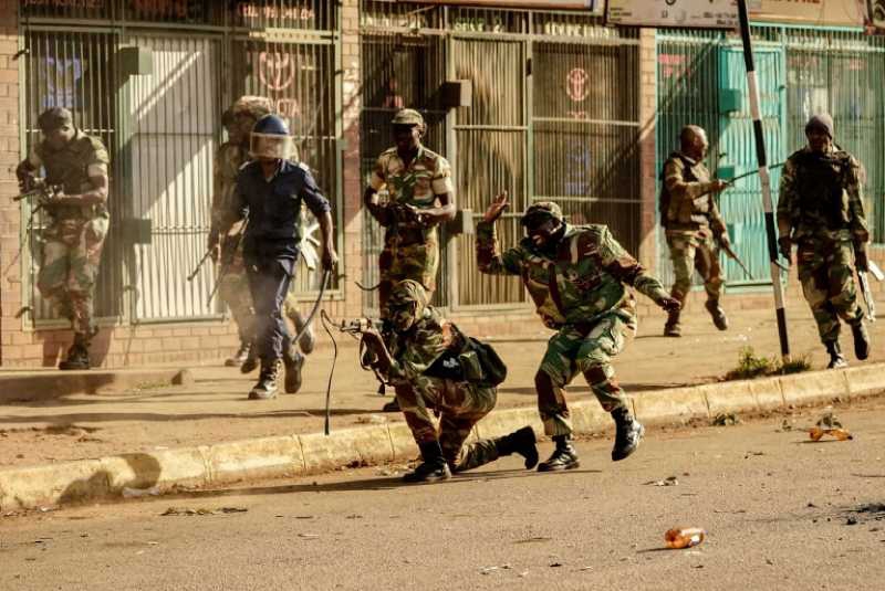 Zimbabwe army clears streets as election panel begs for 'patience'