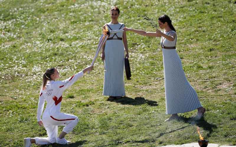 Tokyo 2020 torch lit behind closed doors in ancient Olympia