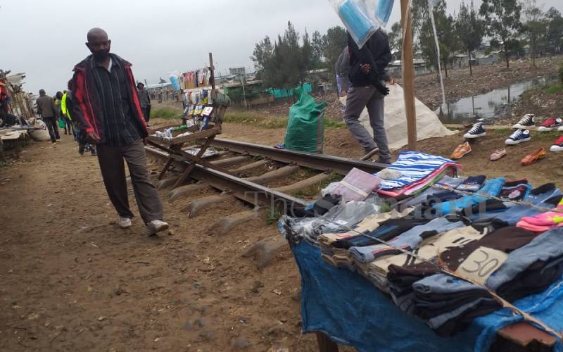 Perilous trade: Market on the rail line at Mukuru slums 