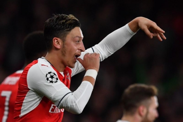 Watch Mesut Ozil personally escort his Champions League hat-trick match ball into his home