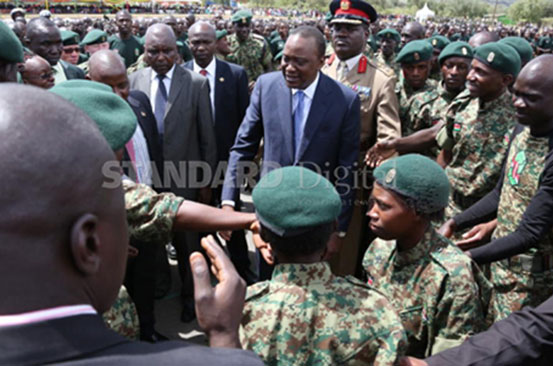 President Uhuru Kenyatta and NYS Director Nelson Githinji greet recruits with disabilities at National Youth Services College in Gilgil 
