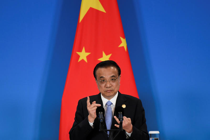 China talks up post-virus rebound as world economy shuts