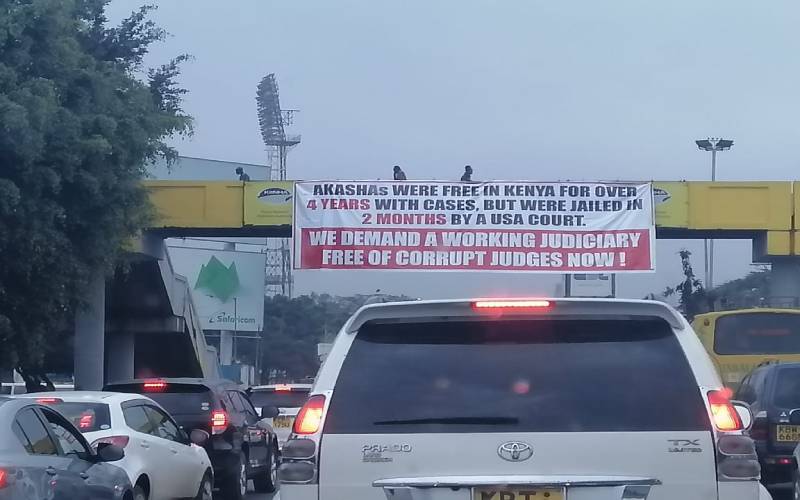 City wakes up to Judiciary-bashing banners