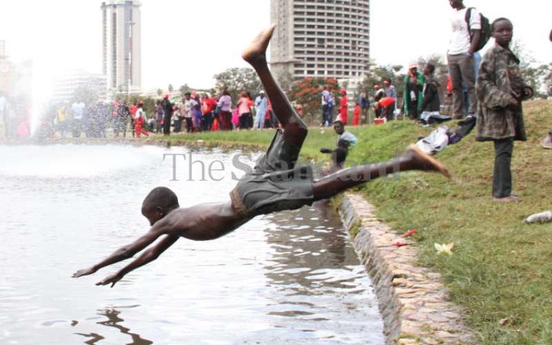 The boys laze at the boat riding pool...