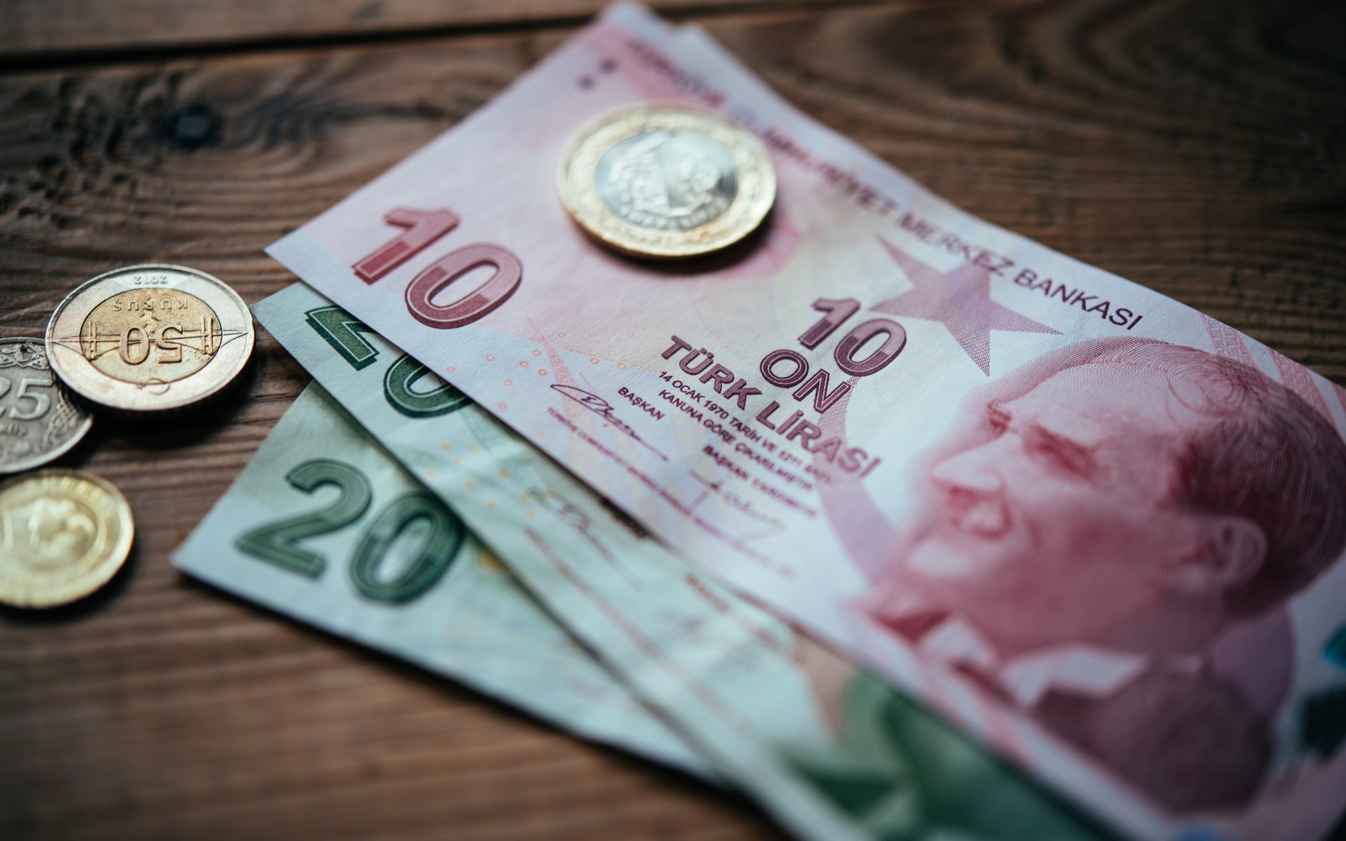 Turkish lira edges up from record low