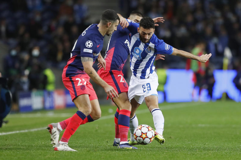 Champions League:  Atletico reach knockout stage with remarkable win at Porto 
