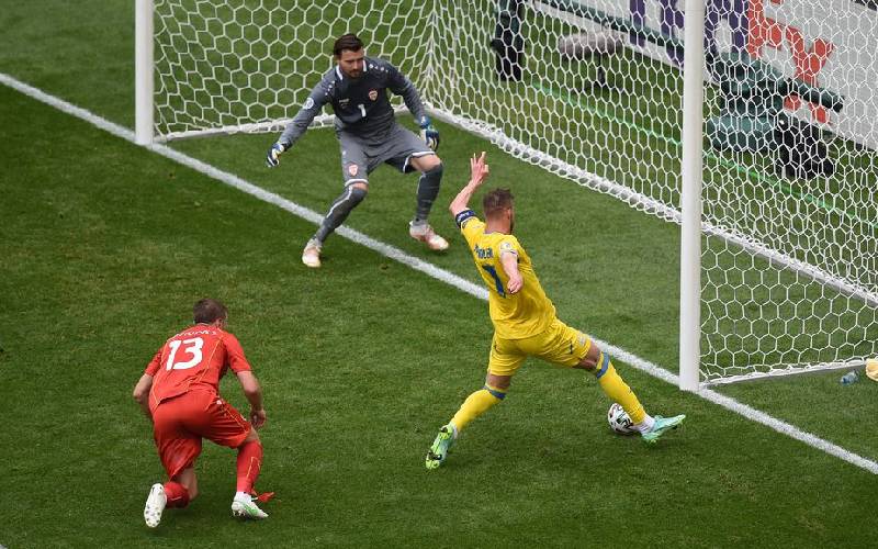 Ukraine's Andriy Yarmolenko scores against N.M