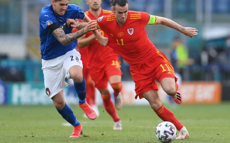 Gareth Bale in action with Italy's Giovanni 