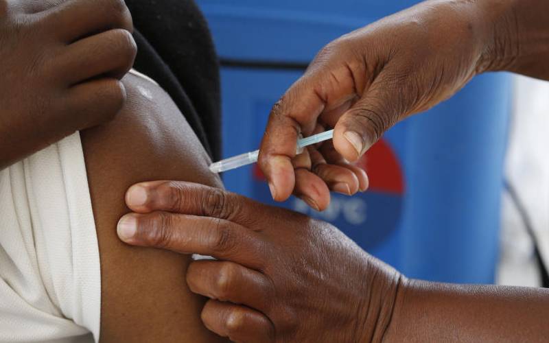 A healthcare worker vaccinates a member of the public during the Launch of Covid-19 Mass Vaccination Drive [Stafford Ondego, Standard]