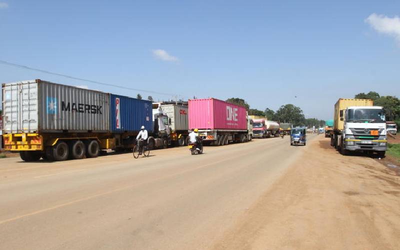 Truck drivers and their crew drive bustling day-and-night service economy in Kanduyi
