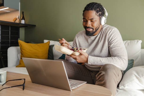 Man eating black beans. [PHOTO: ISTOCK]