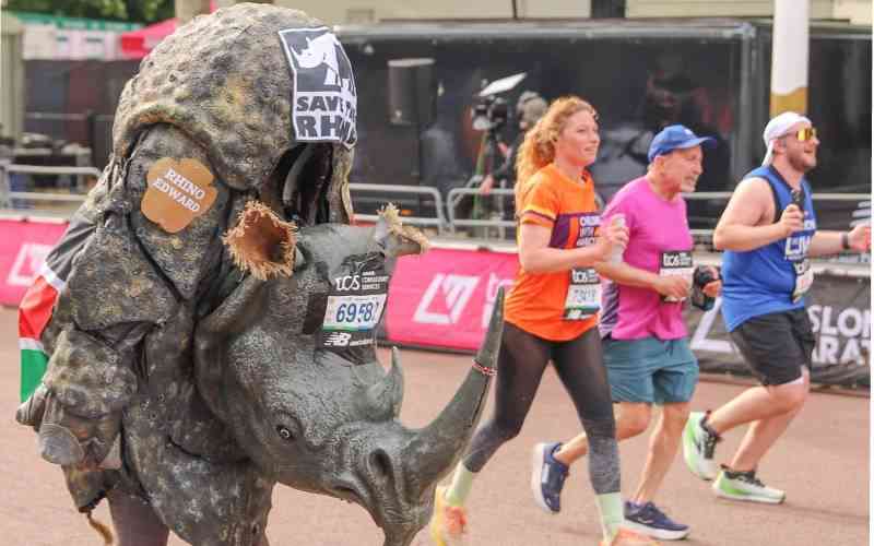 Kenyan ranger completes London Marathon in rhino suit to raise awareness for wildlife conservation