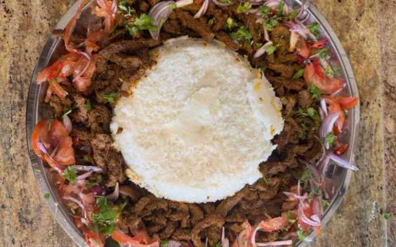 Spicy sautéed beef with ugali and kachumbari
