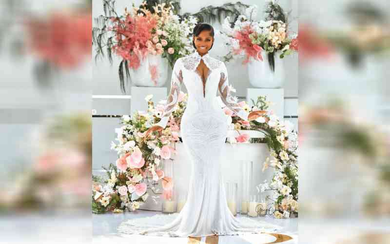 The fabric, a delicate and intricate lace, was heavily embellished with what appears to be sequins and various types of beads