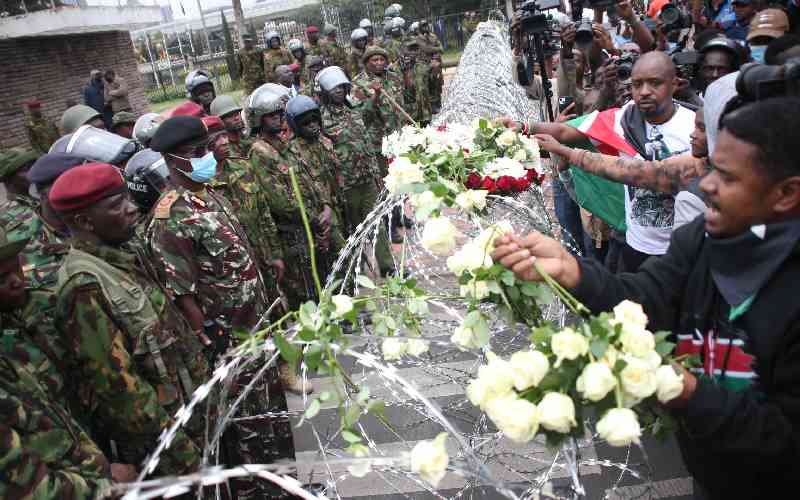 Wreaths, barriers mark protest anniversary