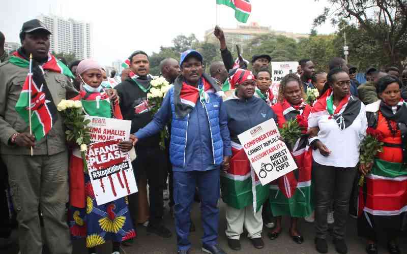 Wreaths, barriers mark protest anniversary