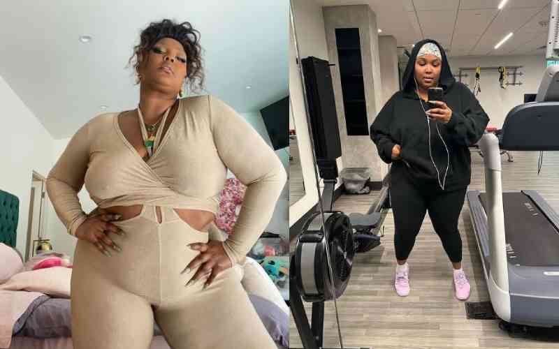 Woman plus size in gym doing exercises with training apparatus